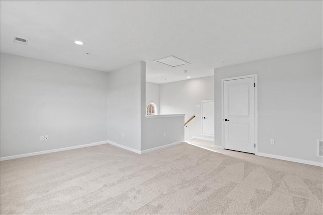 unfurnished room with light colored carpet