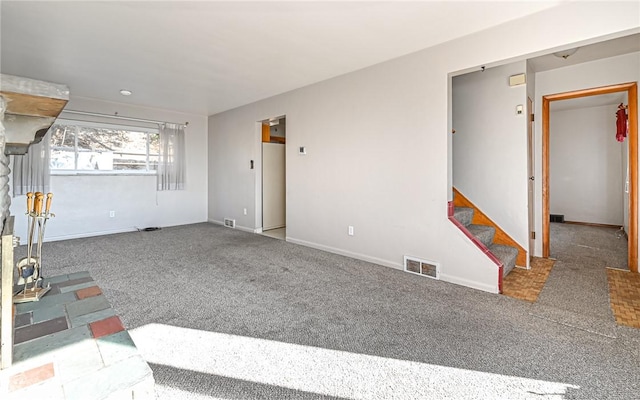 unfurnished living room featuring carpet flooring