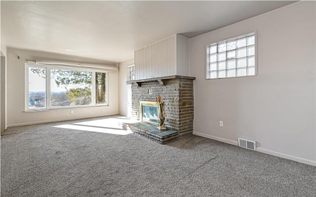 unfurnished living room featuring carpet and a fireplace