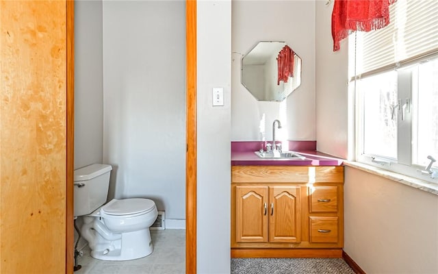 bathroom with tile patterned floors, sink, and toilet