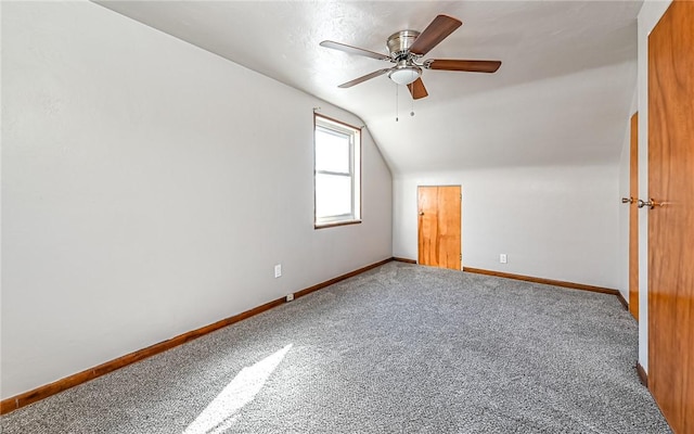 bonus room featuring carpet floors, vaulted ceiling, and ceiling fan