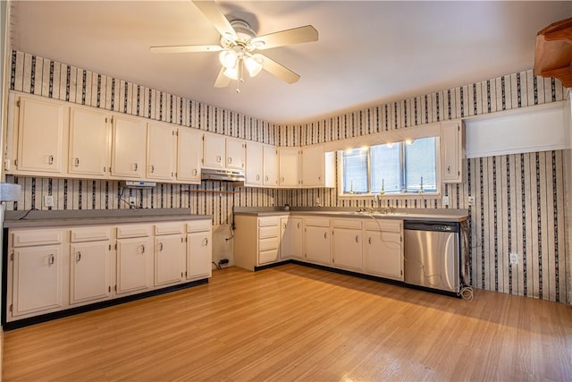 kitchen with stainless steel dishwasher, ceiling fan, sink, light hardwood / wood-style flooring, and white cabinets