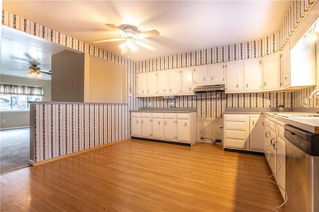 kitchen with white cabinets, ceiling fan, sink, light hardwood / wood-style flooring, and dishwasher