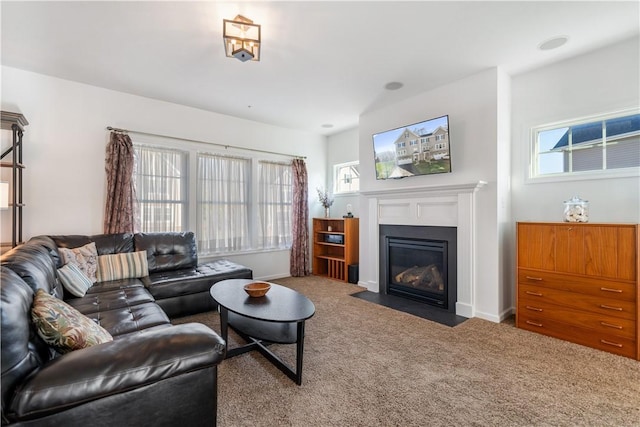 living room featuring carpet floors and a wealth of natural light