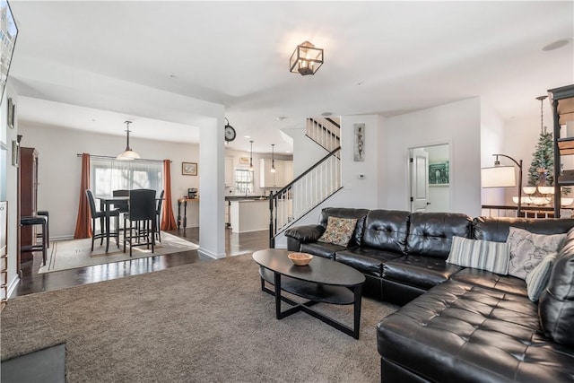 living room featuring dark wood-type flooring