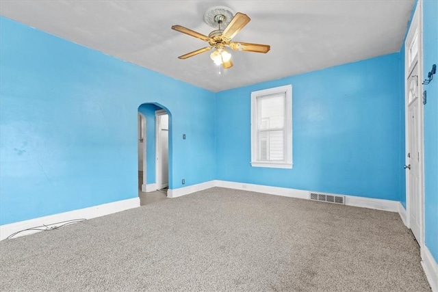 spare room featuring carpet flooring and ceiling fan