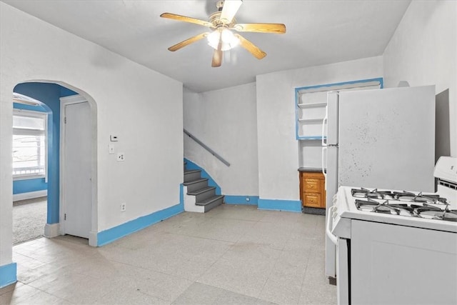 kitchen featuring ceiling fan and white appliances