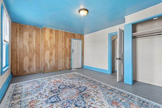 unfurnished bedroom featuring light hardwood / wood-style floors and a closet