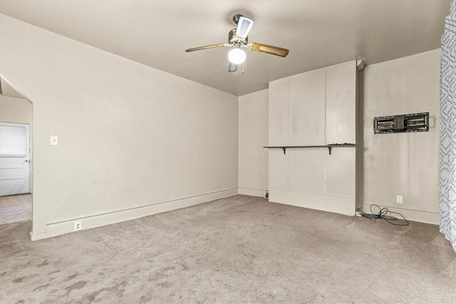 carpeted empty room with ceiling fan