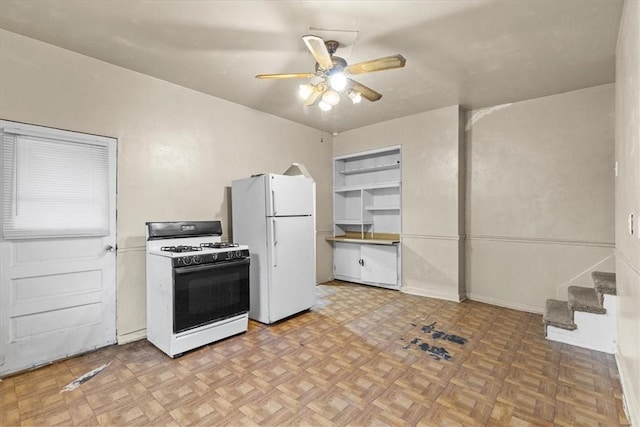 kitchen with ceiling fan, light parquet floors, and white appliances