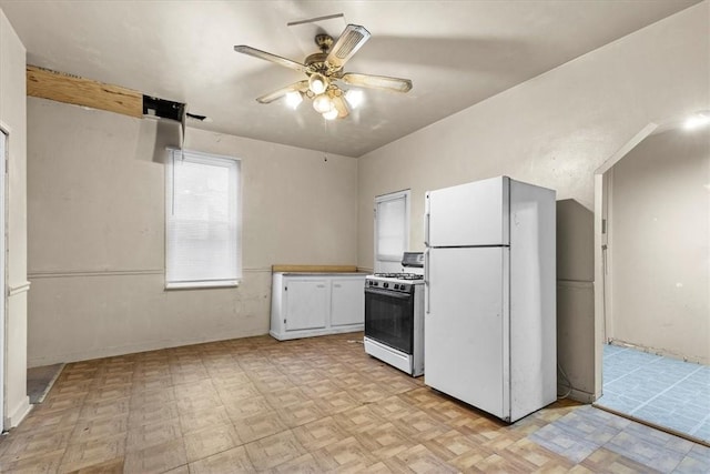 kitchen featuring ceiling fan, light parquet floors, white cabinets, and white appliances