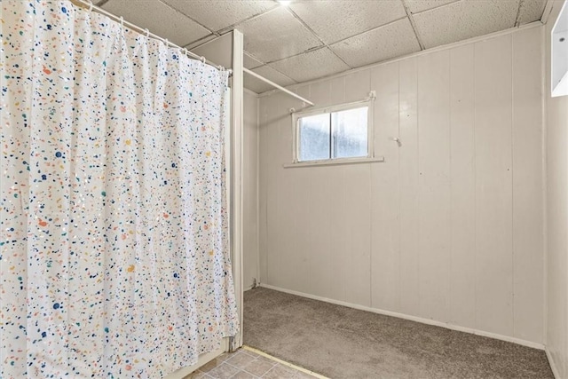 bathroom with a paneled ceiling