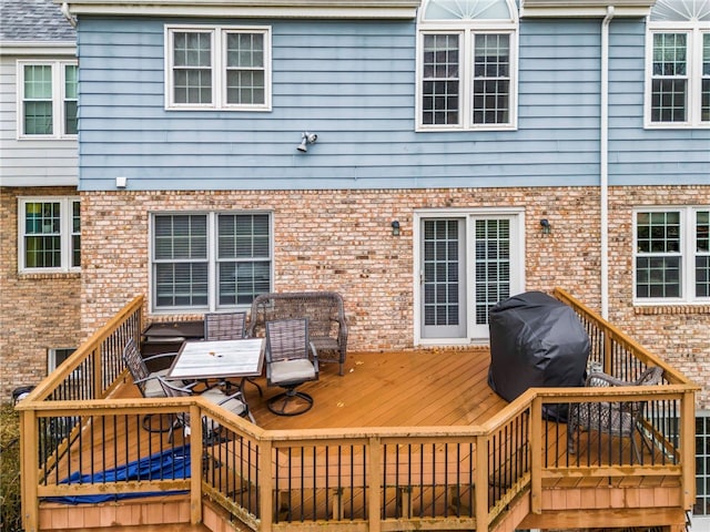 wooden terrace with area for grilling