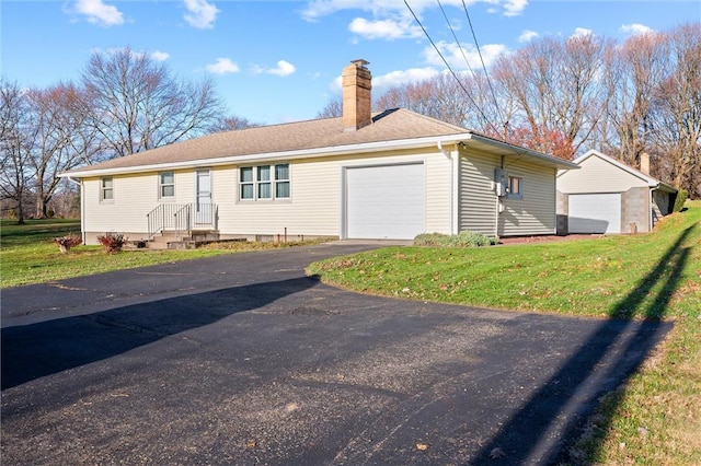 exterior space with a lawn and a garage