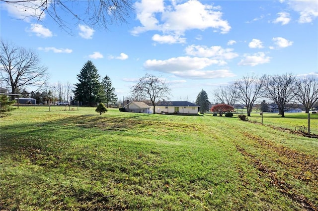 view of yard with a rural view