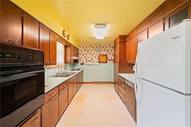 kitchen featuring sink and white appliances