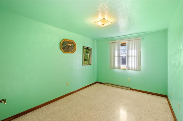 empty room featuring baseboard heating