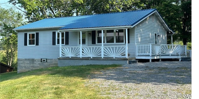 view of front of property with a front yard and a porch