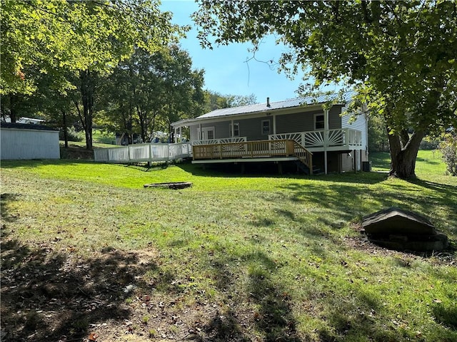 view of yard featuring a wooden deck