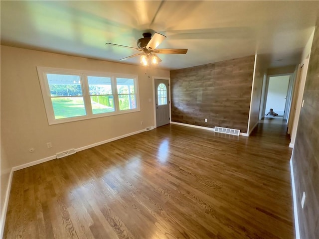 interior space with ceiling fan and hardwood / wood-style floors