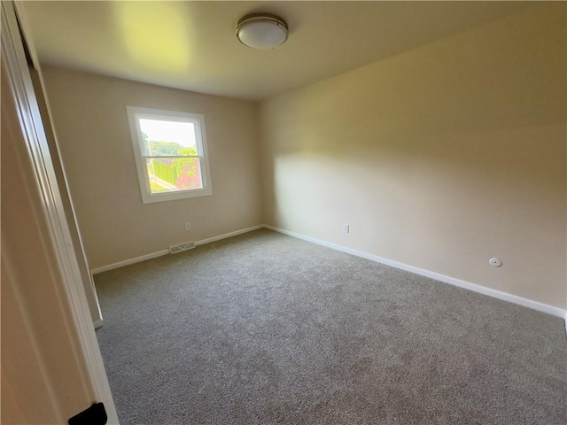 spare room featuring carpet flooring