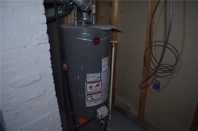 utility room with gas water heater