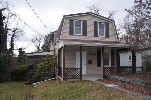 view of property with a porch and a front lawn