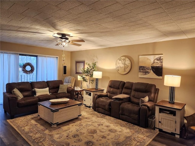 living room with wood-type flooring and ceiling fan