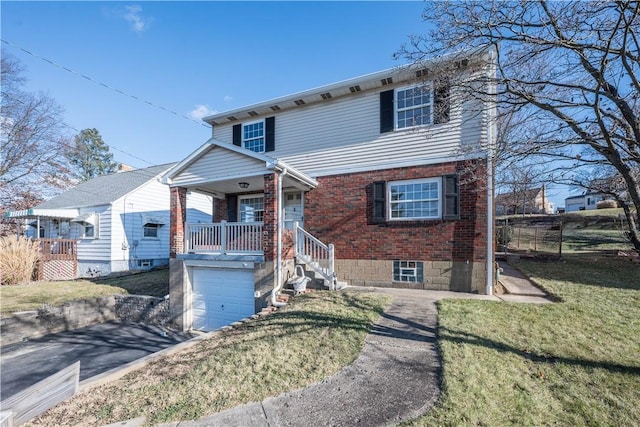 view of front of property featuring covered porch, a front yard, and a garage