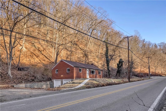 view of side of home featuring a garage