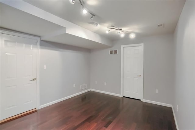 basement featuring dark wood-type flooring