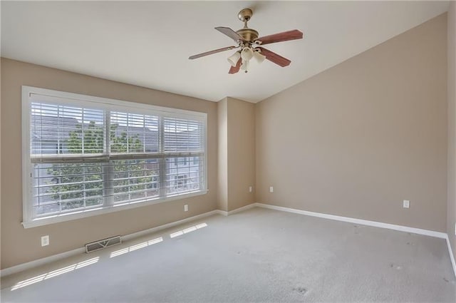 spare room with light carpet and ceiling fan