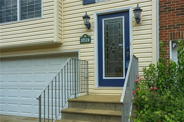 doorway to property featuring a garage