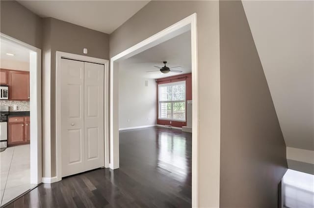 hallway with dark wood-type flooring