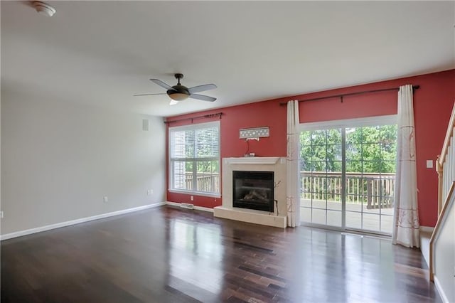 unfurnished living room with ceiling fan and hardwood / wood-style flooring