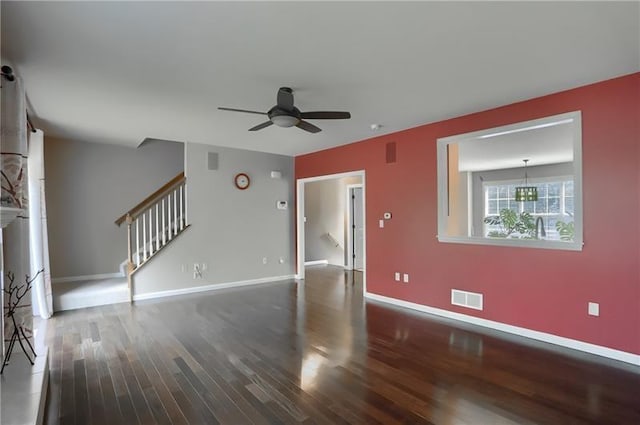 unfurnished living room with a fireplace, hardwood / wood-style floors, and ceiling fan