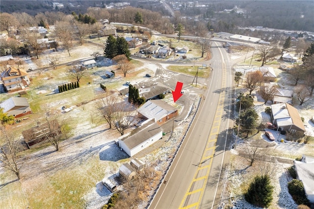 birds eye view of property with a residential view