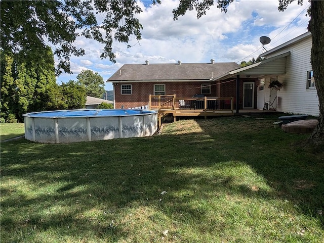 exterior space with a lawn and a wooden deck