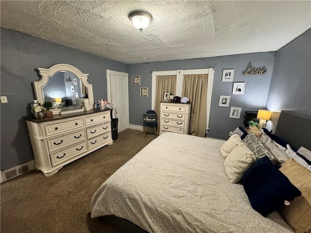 carpeted bedroom with a textured ceiling