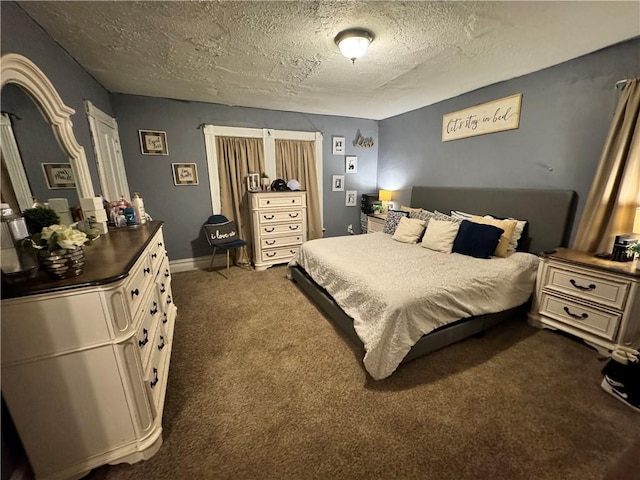 carpeted bedroom featuring a textured ceiling