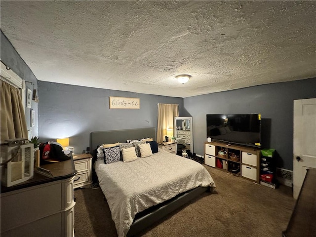 carpeted bedroom featuring a textured ceiling