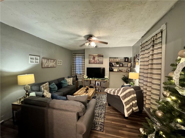 living room with ceiling fan and hardwood / wood-style flooring