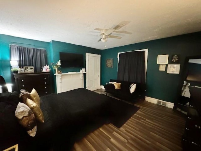 bedroom featuring ceiling fan and dark hardwood / wood-style flooring