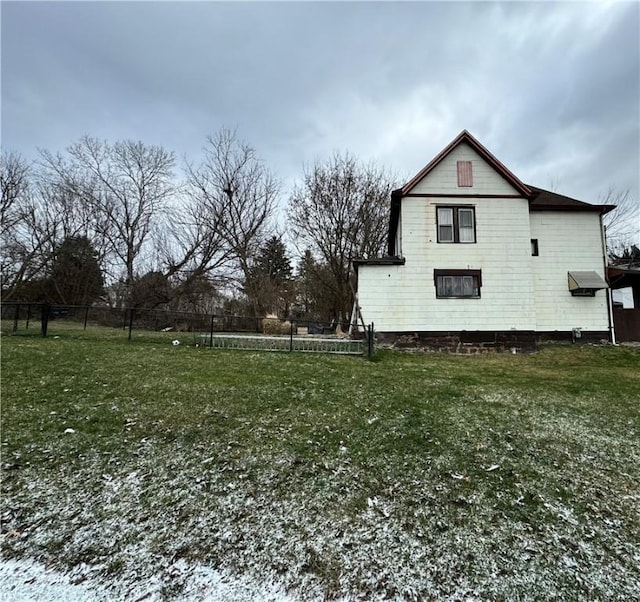 view of property exterior with a yard