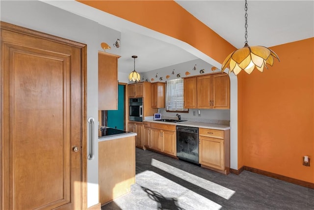 kitchen featuring dishwasher, stainless steel oven, decorative light fixtures, and sink