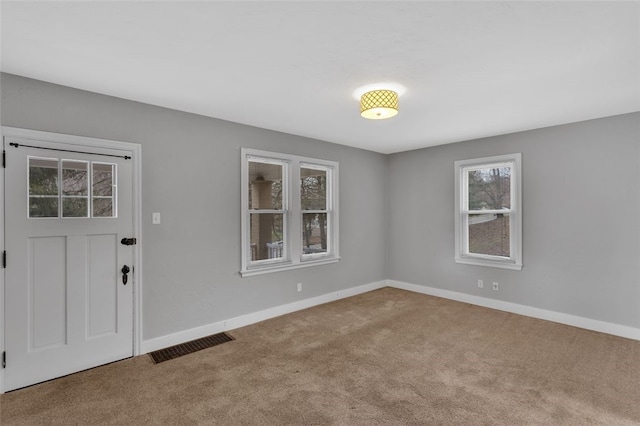 view of carpeted entrance foyer