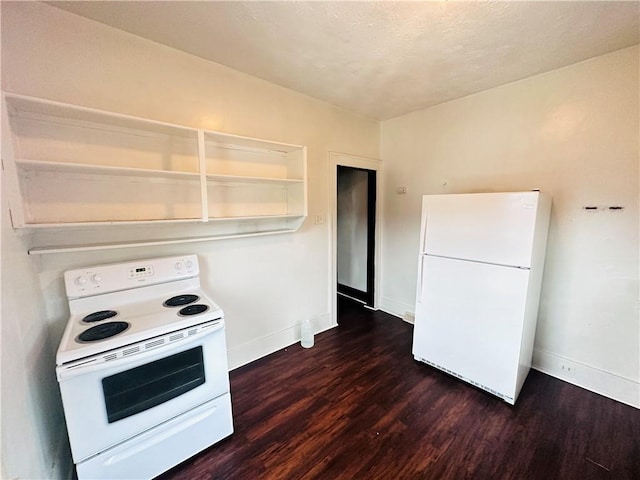 kitchen featuring dark hardwood / wood-style floors and white appliances