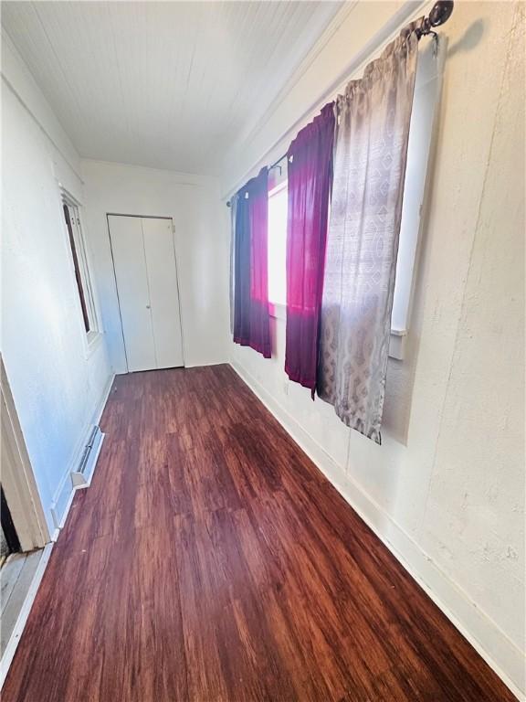 unfurnished bedroom with hardwood / wood-style flooring