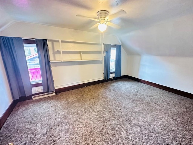 bonus room with carpet flooring, vaulted ceiling, and ceiling fan