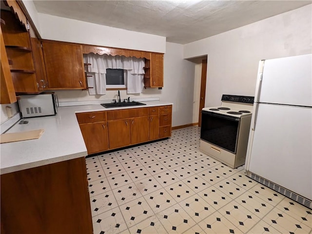 kitchen with white appliances and sink